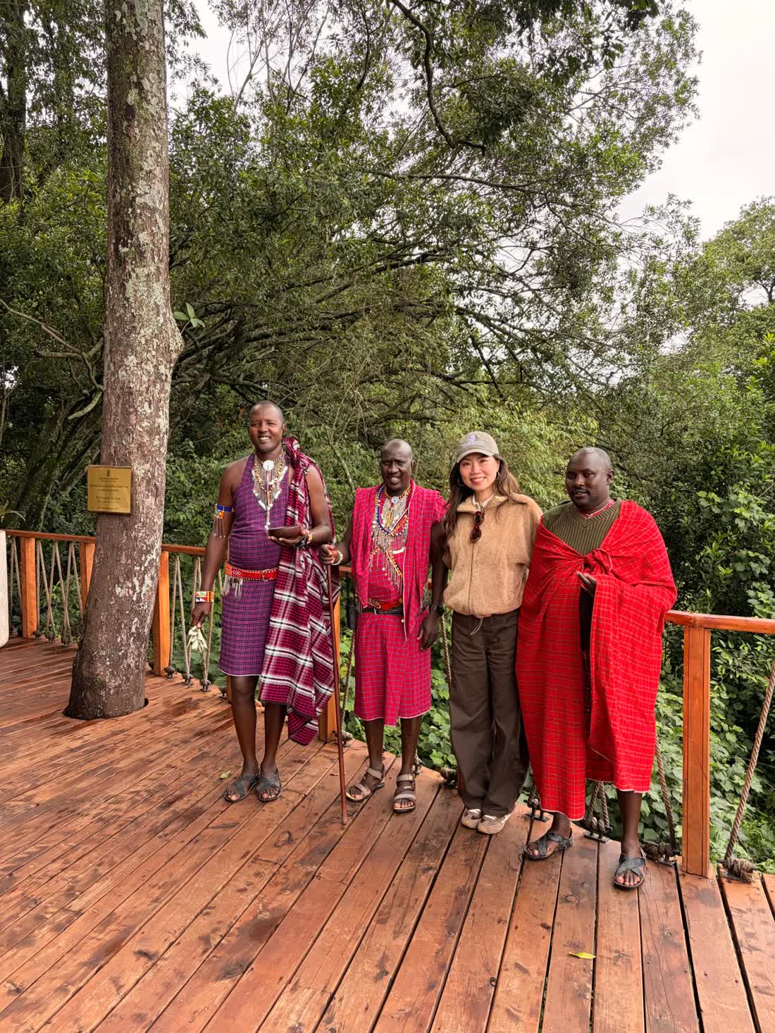 Annie Brent seated outdoors with Maasai community partners