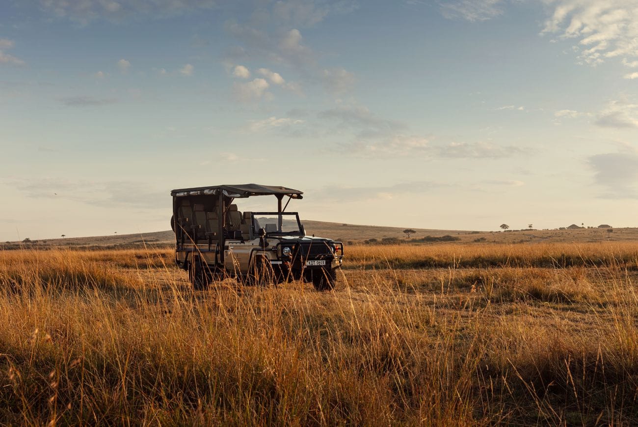 Open Land Cruiser on the plains at golden hour